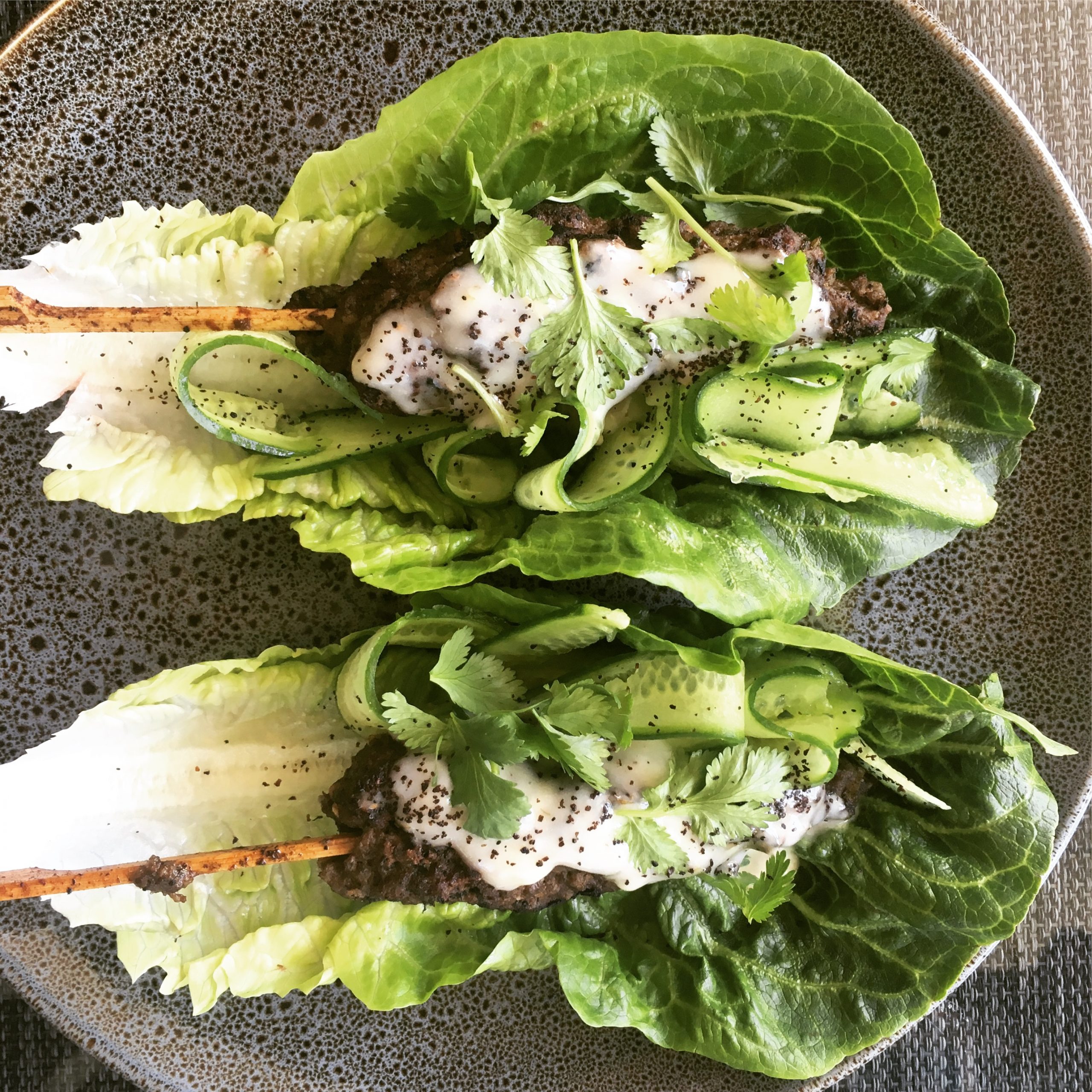 Beef koftas with yoghurt dressing on lettuce wraps